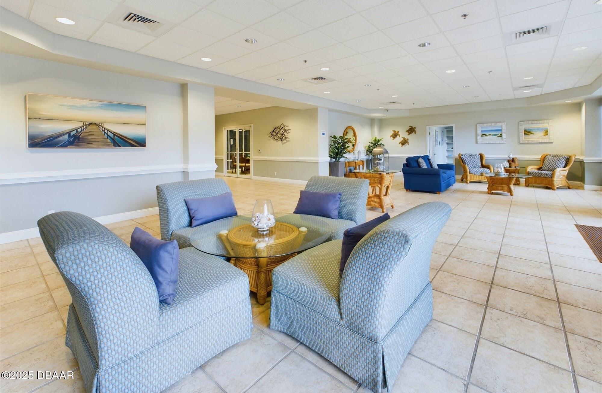 4670 Links Village Drive, Unit C601 Ponce Inlet, FL 32127 - Photo 50 of 68 a living room with furniture kitchen view and a window