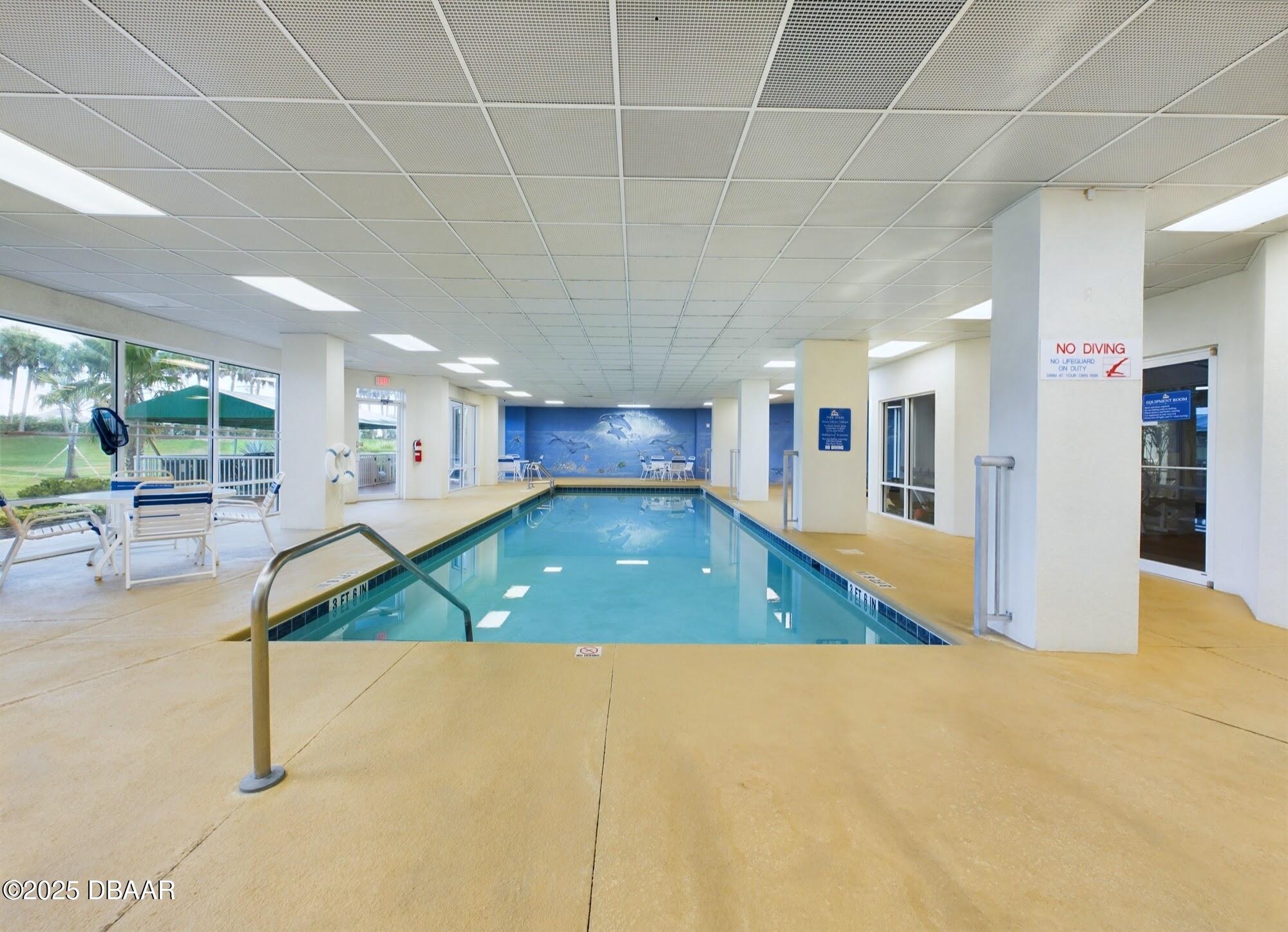 4670 Links Village Drive, Unit C601 Ponce Inlet, FL 32127 - Photo 54 of 68 a view of an empty room with kitchen view