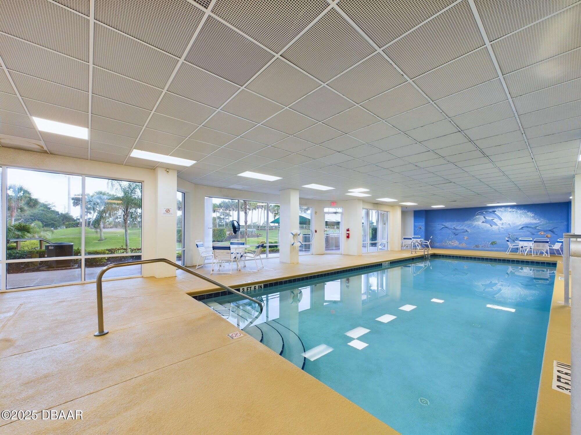 4670 Links Village Drive, Unit C601 Ponce Inlet, FL 32127 - Photo 55 of 68 a view of a swimming pool and outdoor space
