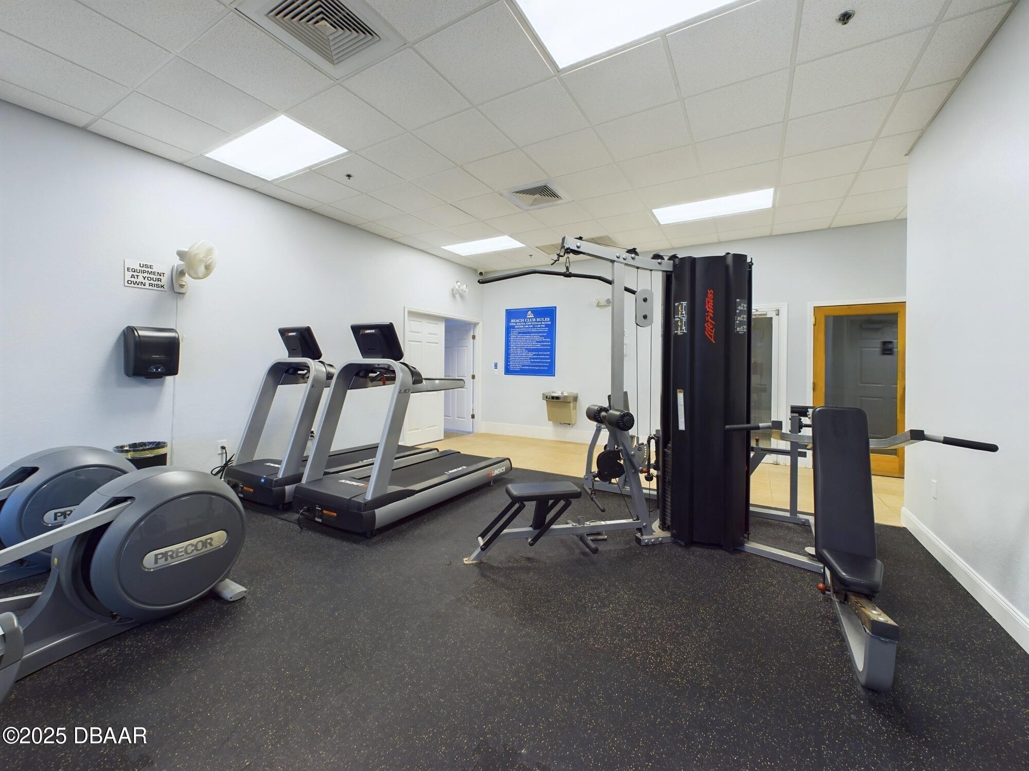 4670 Links Village Drive, Unit C601 Ponce Inlet, FL 32127 - Photo 61 of 68 a view of a room with gym equipment