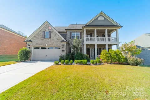a living room with furniture a table and a window