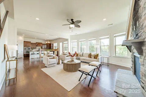 a bathroom with a granite countertop sink a toilet and a mirror