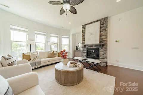 a bathroom with a granite countertop shower a mirror and a sink