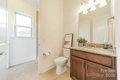 an empty room with closet and a ceiling fan