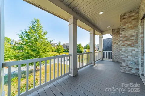 a spacious bathroom with a granite countertop tub sink a mirror a shower and vanity