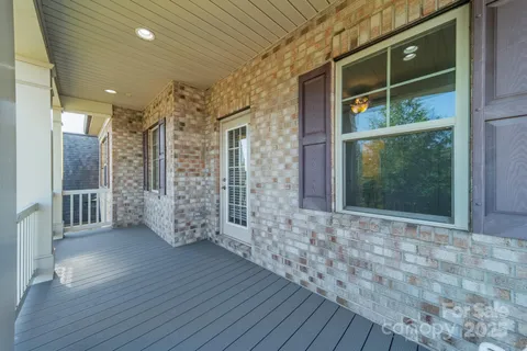 a spacious bathroom with a granite countertop tub sink shower and mirror