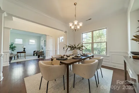 a kitchen with wooden floors and wooden cabinets