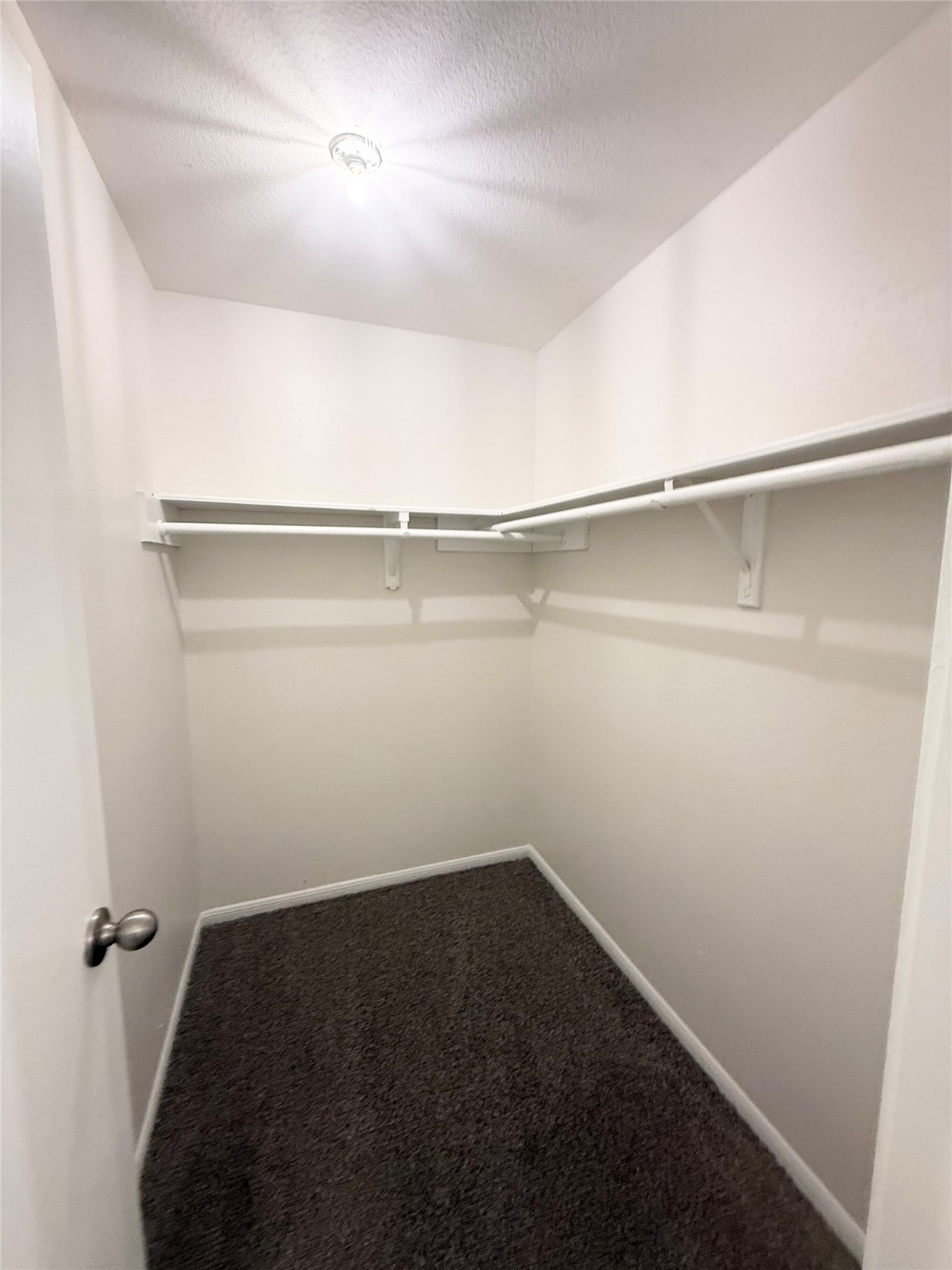 1477 Springrock Lane, Unit 12 Houston, TX 77055 - Photo 16 of 24 a view of a room with racks on the wall