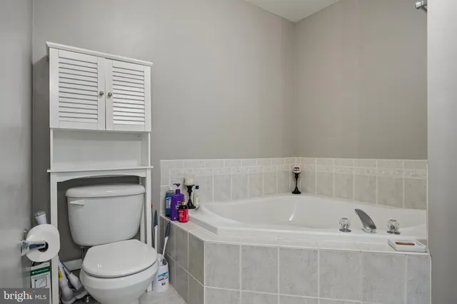 a bathroom with a shower sink and mirror