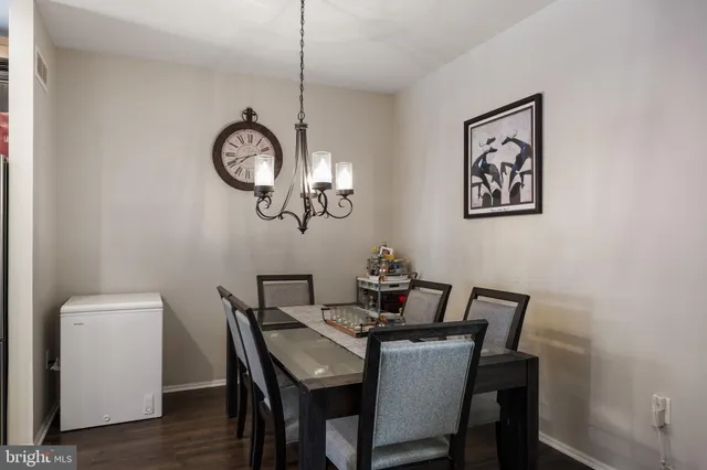 a kitchen with stainless steel appliances a stove a refrigerator and a fireplace