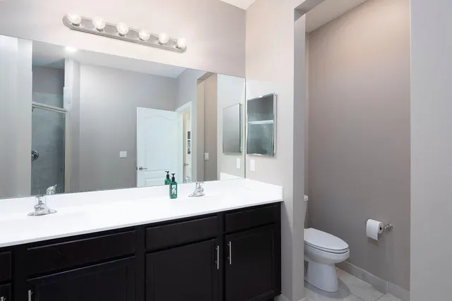 a bathroom with a glass shower door