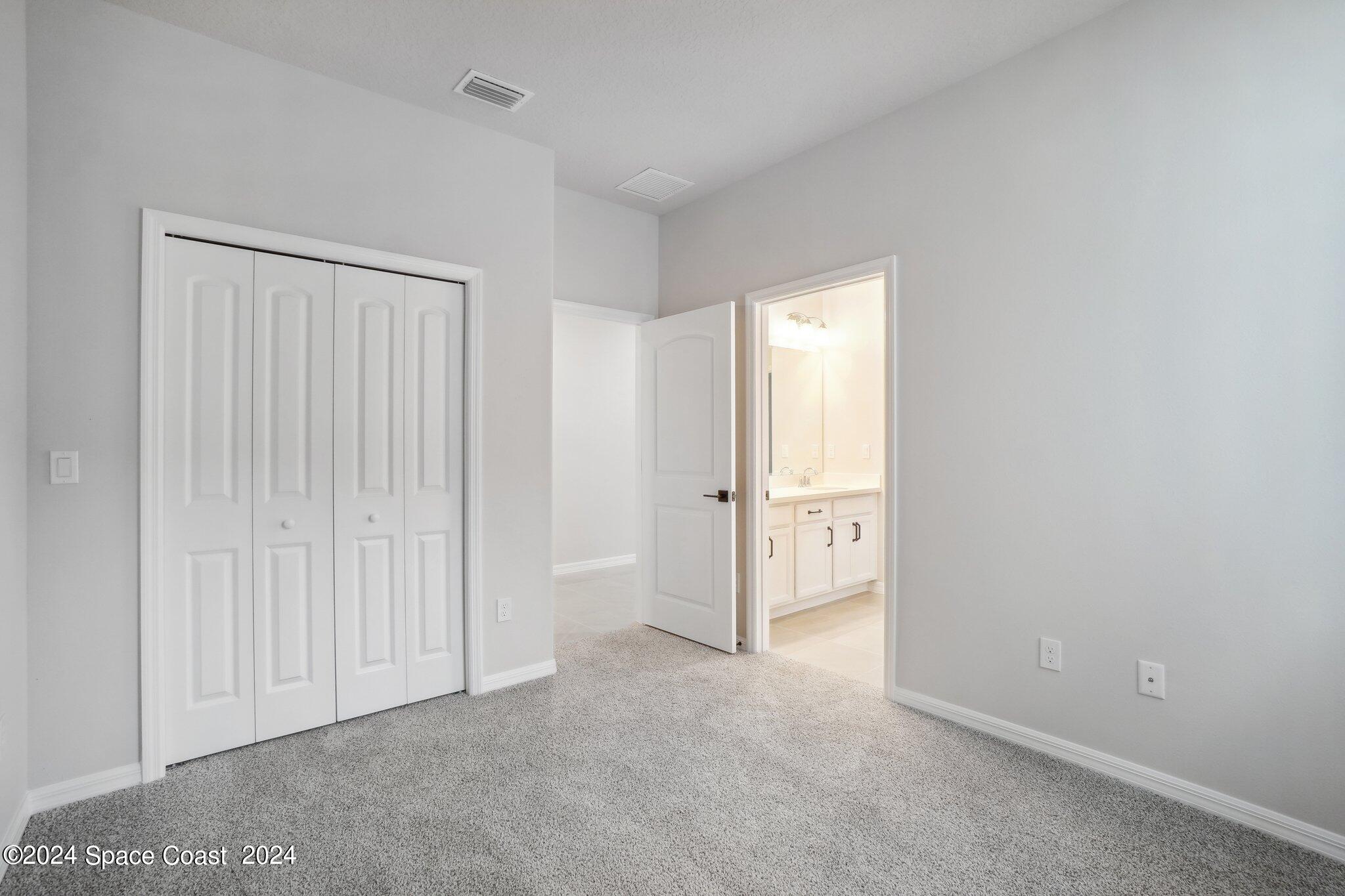 3019 Pangea Circle Melbourne, FL 32940 - Photo 25 of 56 a view of an empty room and closet area