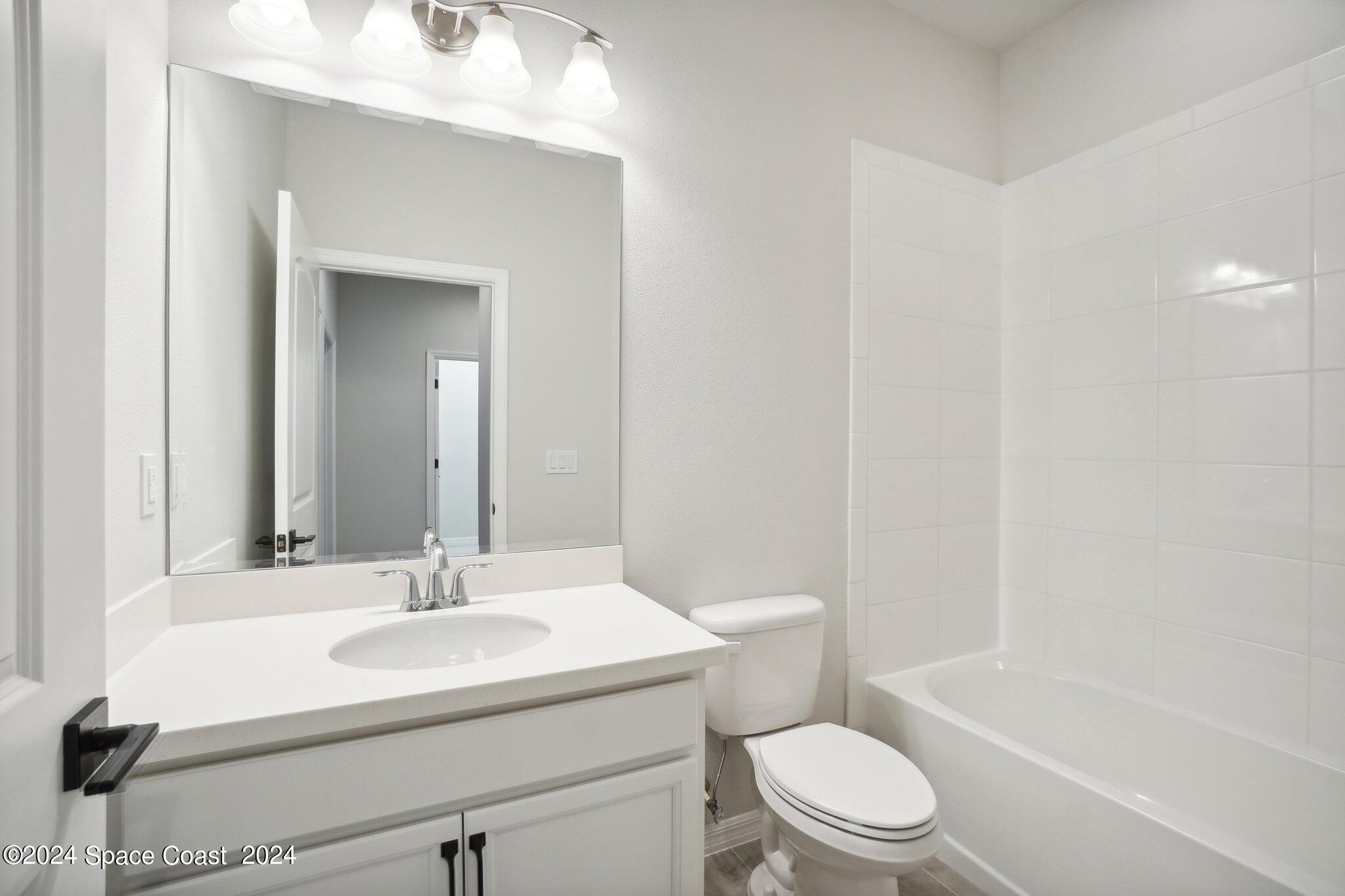 3019 Pangea Circle Melbourne, FL 32940 - Photo 35 of 56 a bathroom with a sink toilet and shower