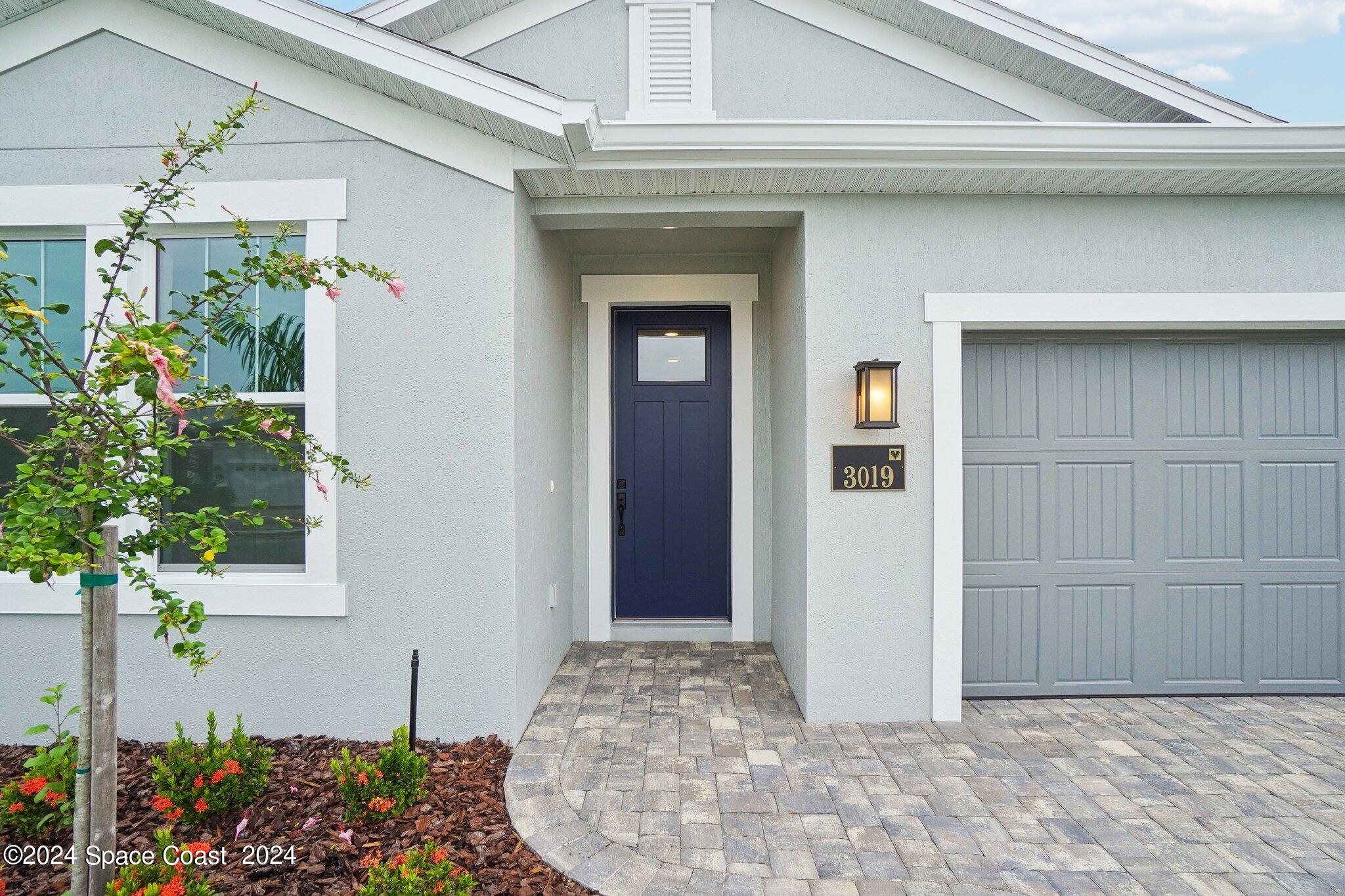3019 Pangea Circle Melbourne, FL 32940 - Photo 5 of 56 a view of a entryway door of the house