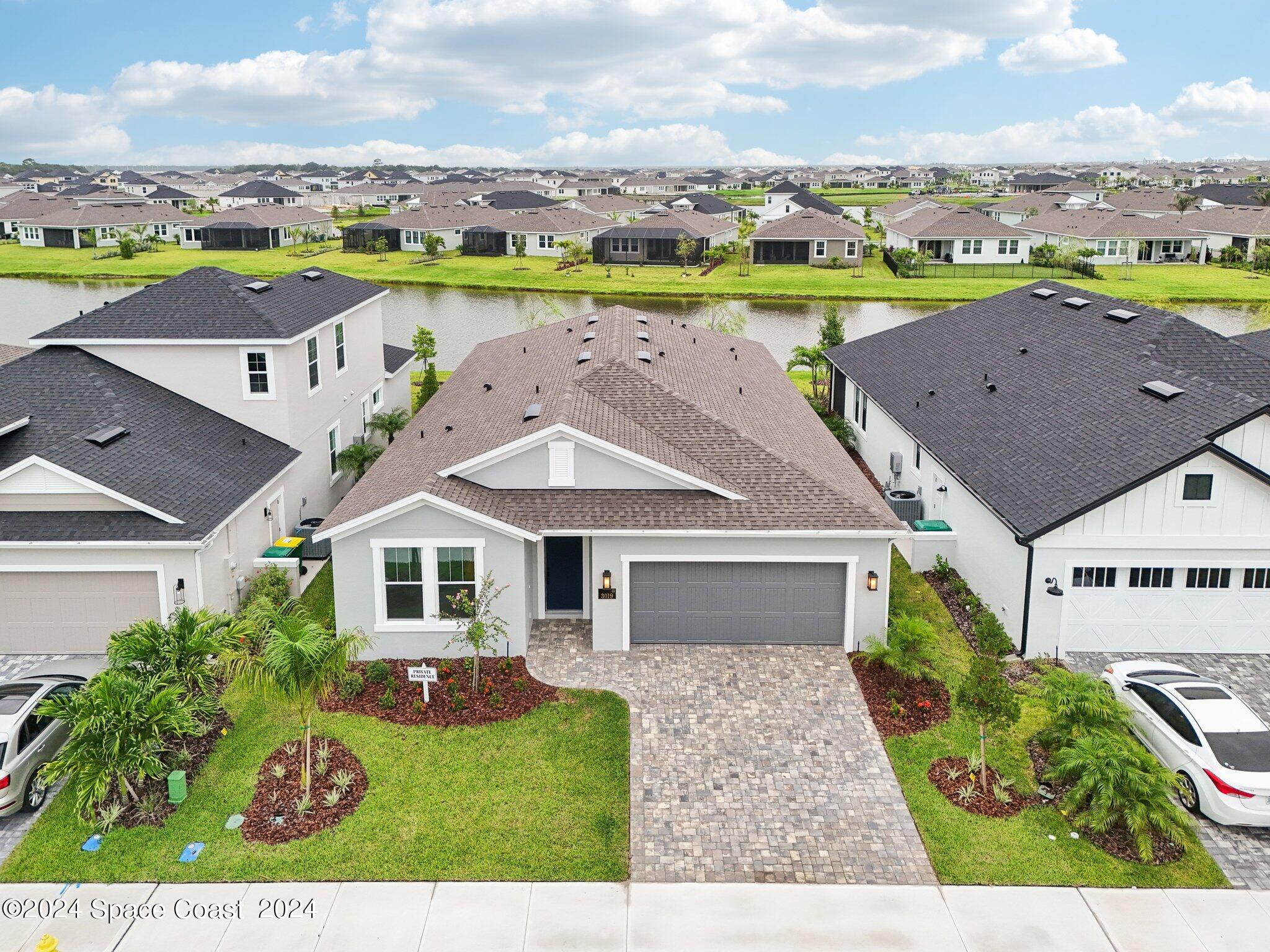 3019 Pangea Circle Melbourne, FL 32940 - Photo 51 of 56 an aerial view of a house with a garden