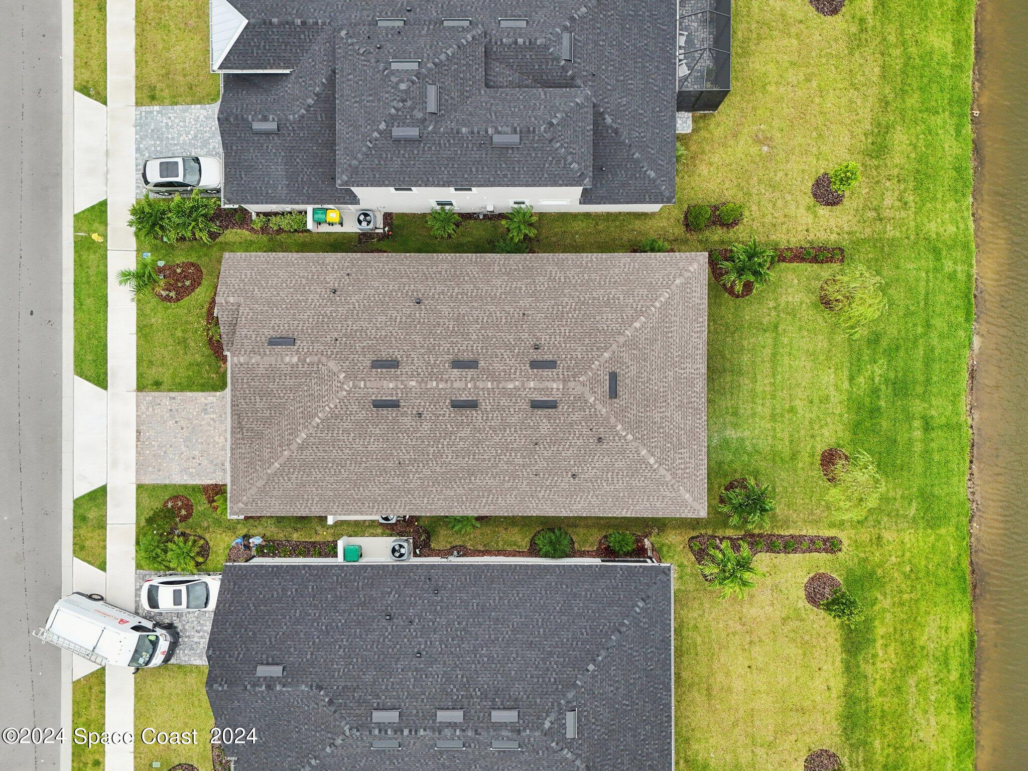 3019 Pangea Circle Melbourne, FL 32940 - Photo 52 of 56 an aerial view of a house with a yard