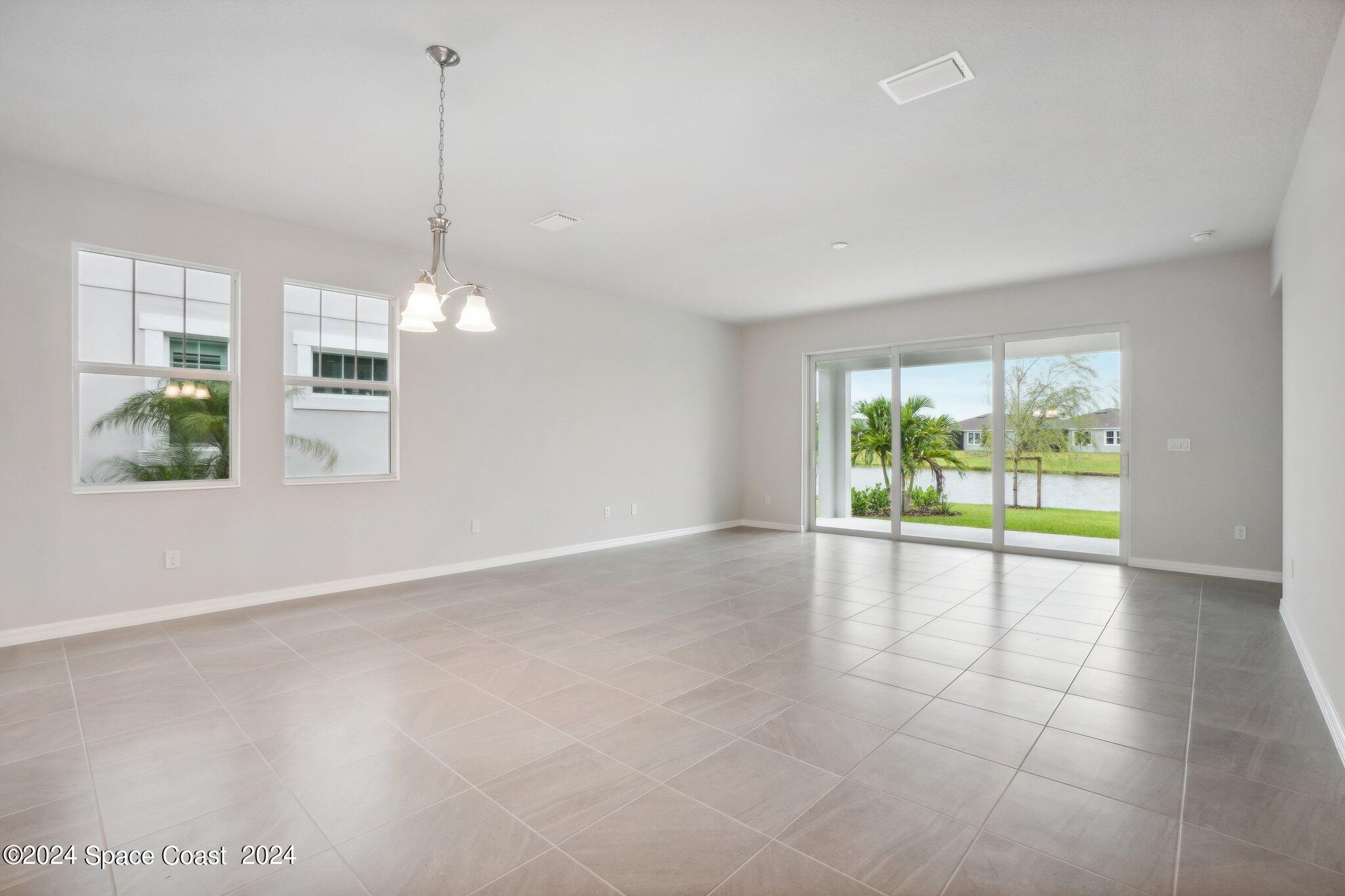 3019 Pangea Circle Melbourne, FL 32940 - Photo 8 of 56 a view of an empty room with a window