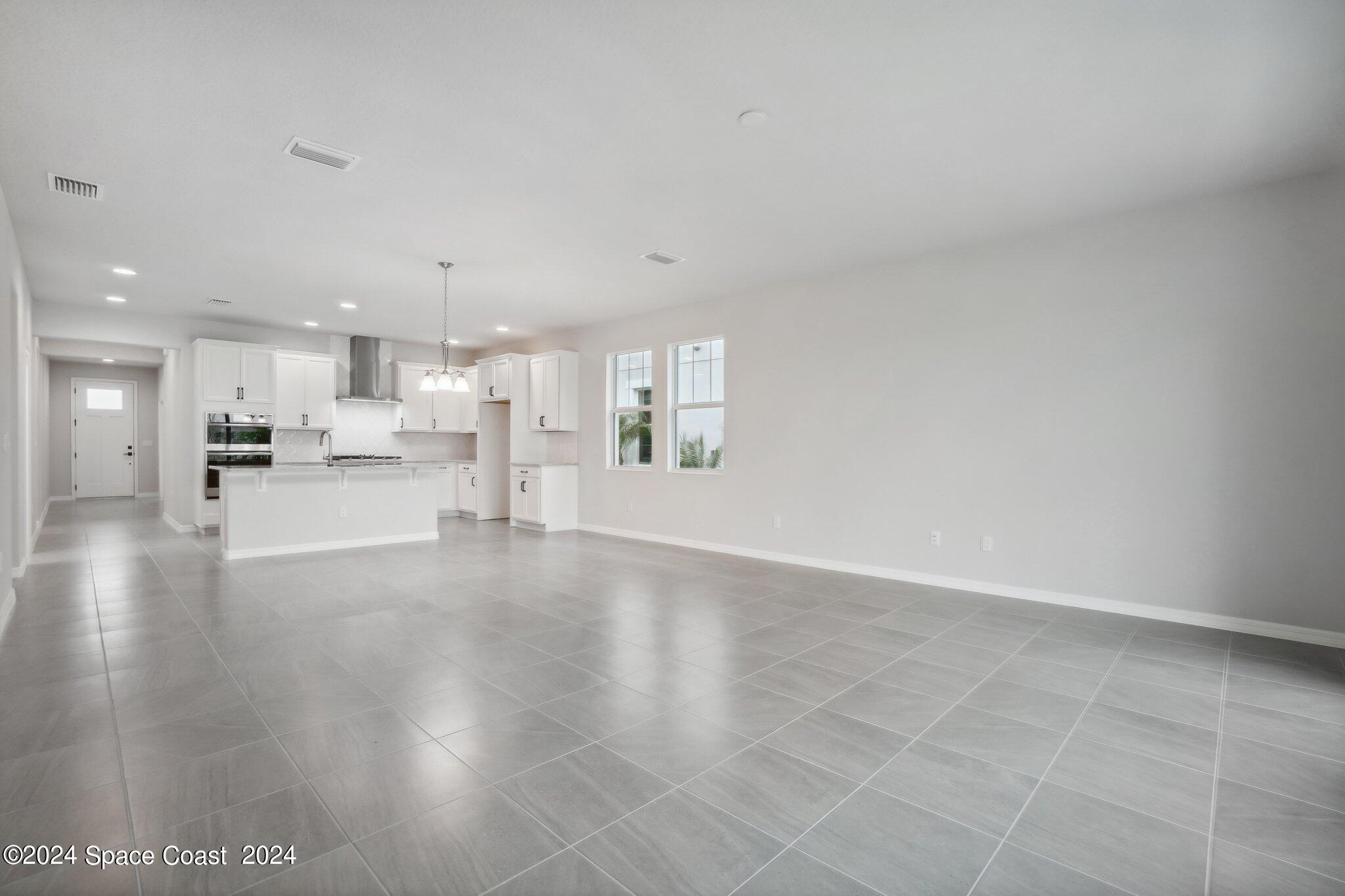 3019 Pangea Circle Melbourne, FL 32940 - Photo 10 of 56 a view of a kitchen with a sink and a stove top oven