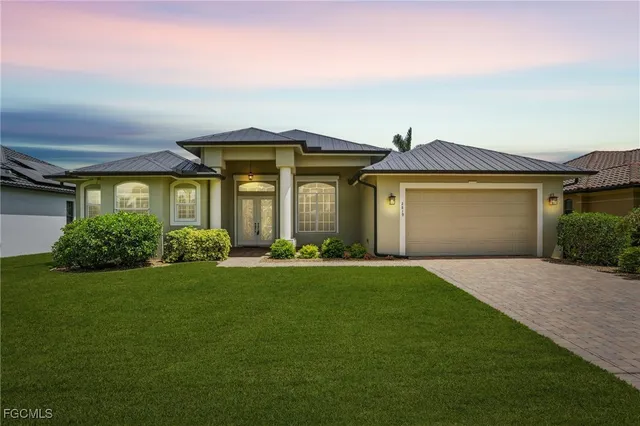 front view of a house with a garden