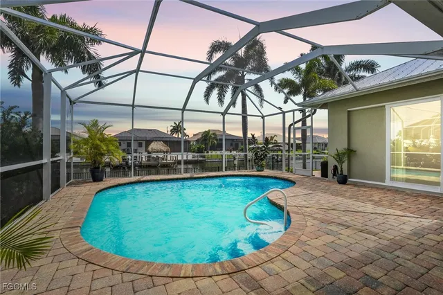 a view of a swimming pool with a patio