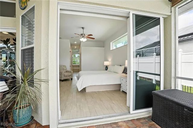 a bathroom with a tub a double vanity sink a window and a mirror