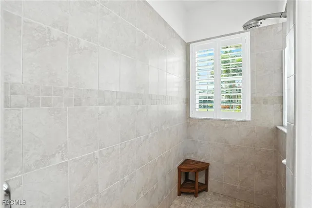 a bedroom with a bed and a chair