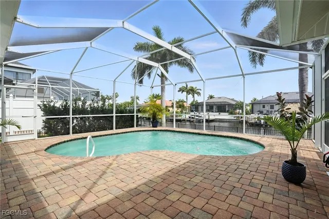 a view of a swimming pool with a patio