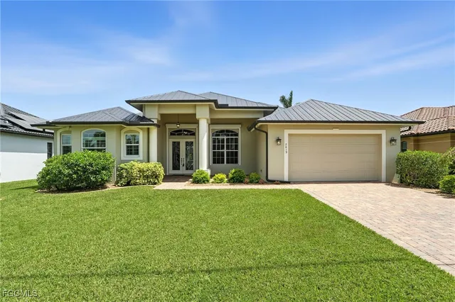 front view of a house with a yard