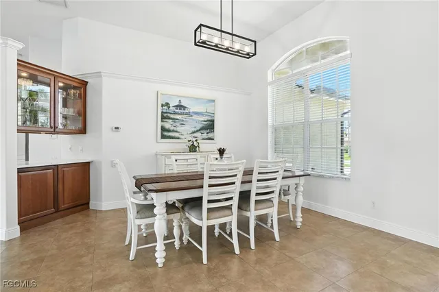 a dining room with furniture and window