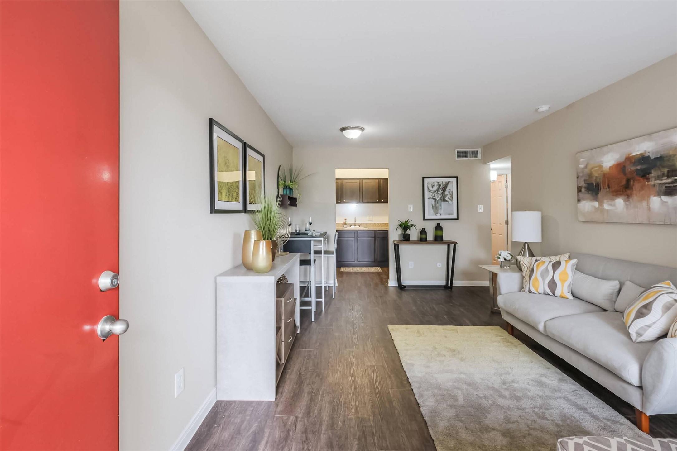 5900 North Braeswood Boulevard, Unit 258 Houston, TX 77074 - Photo 4 of 32 a living room with furniture and a wooden floor