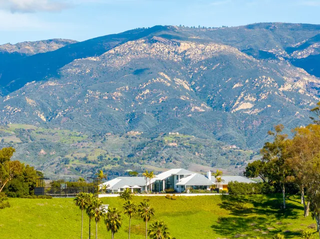a view of a golf course with a big yard