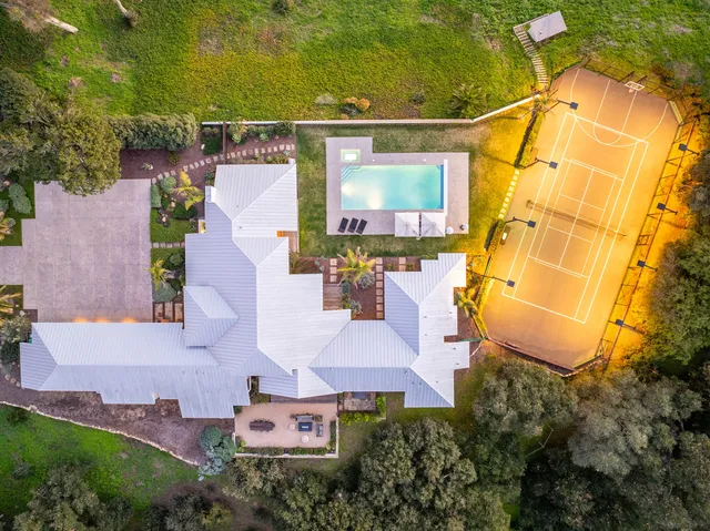 a view of a swimming pool with a patio