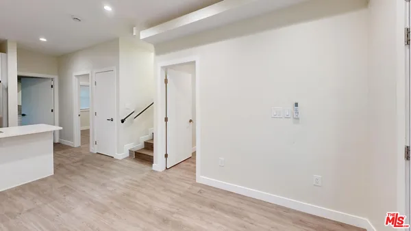 a view of entryway with stairs and wooden floor
