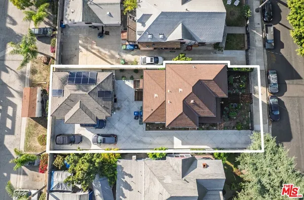 an aerial view of houses with outdoor space