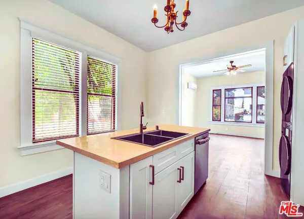 a kitchen with a sink and a window