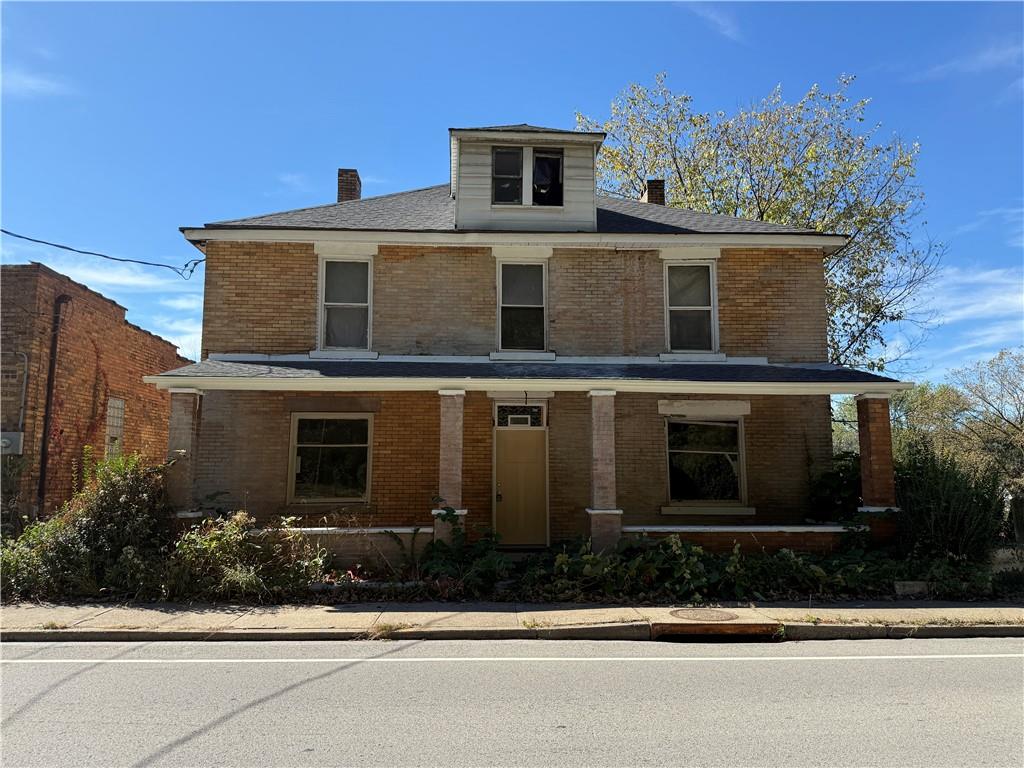 189 Beaver Street Leetsdale, PA 15056 - Photo 1 of 14 a front view of a house with a garden