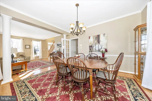a kitchen with kitchen island granite countertop a sink appliances cabinets and a counter top space