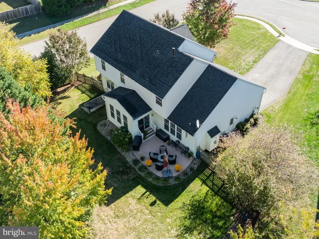 a aerial view of a house with a yard