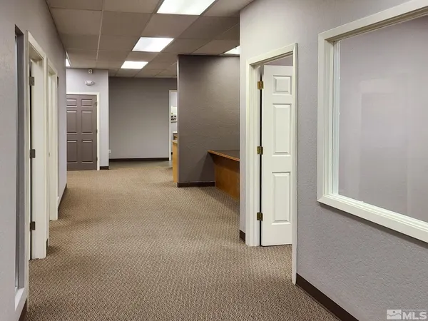 a view of an empty room with empty shelves