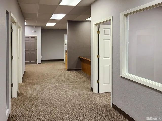 a view of an empty room with empty shelves