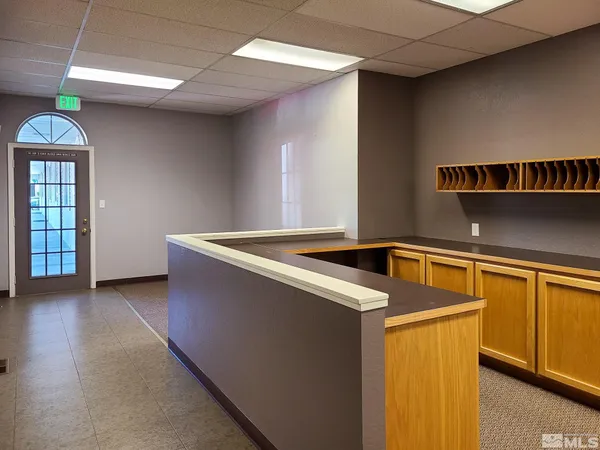 a view of kitchen and empty room