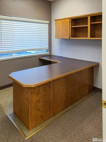 a room with table and flowerpot