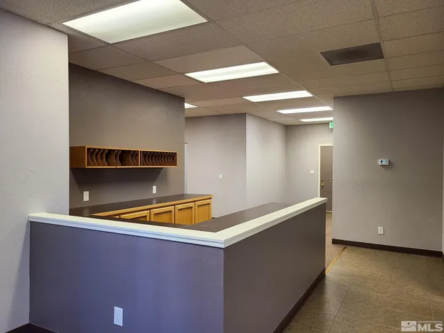 a view of a kitchen with a sink cabinets and a window