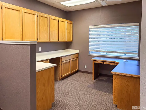 a room with a sink and cabinets