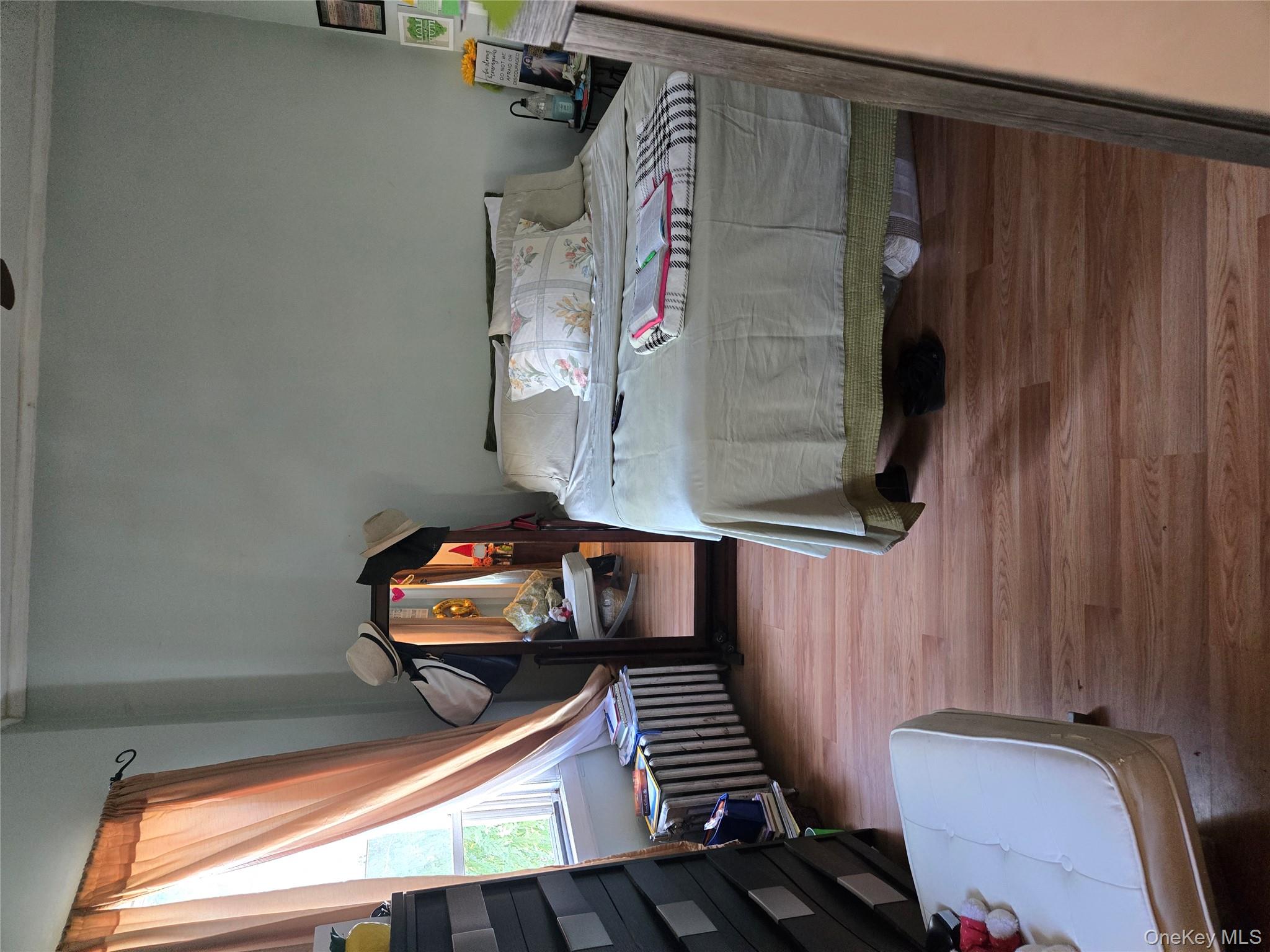 2348 Turnbull Avenue Bronx, NY 10473 - Photo 5 of 6 a bedroom with bed and window