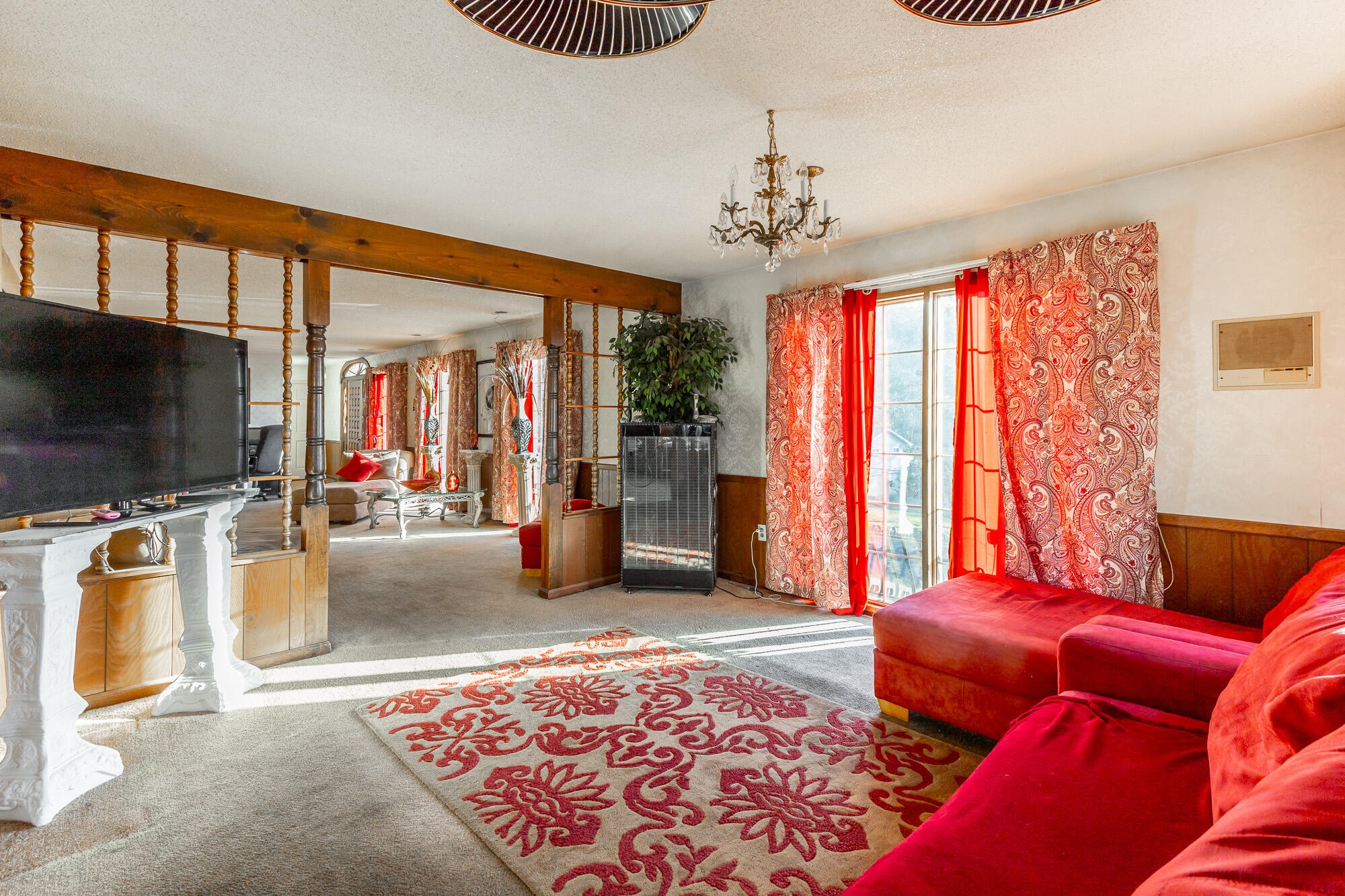 8417 Iris Drive Chattanooga, TN 37421 - Photo 17 of 90 a living room with furniture a flat screen tv and a chandelier