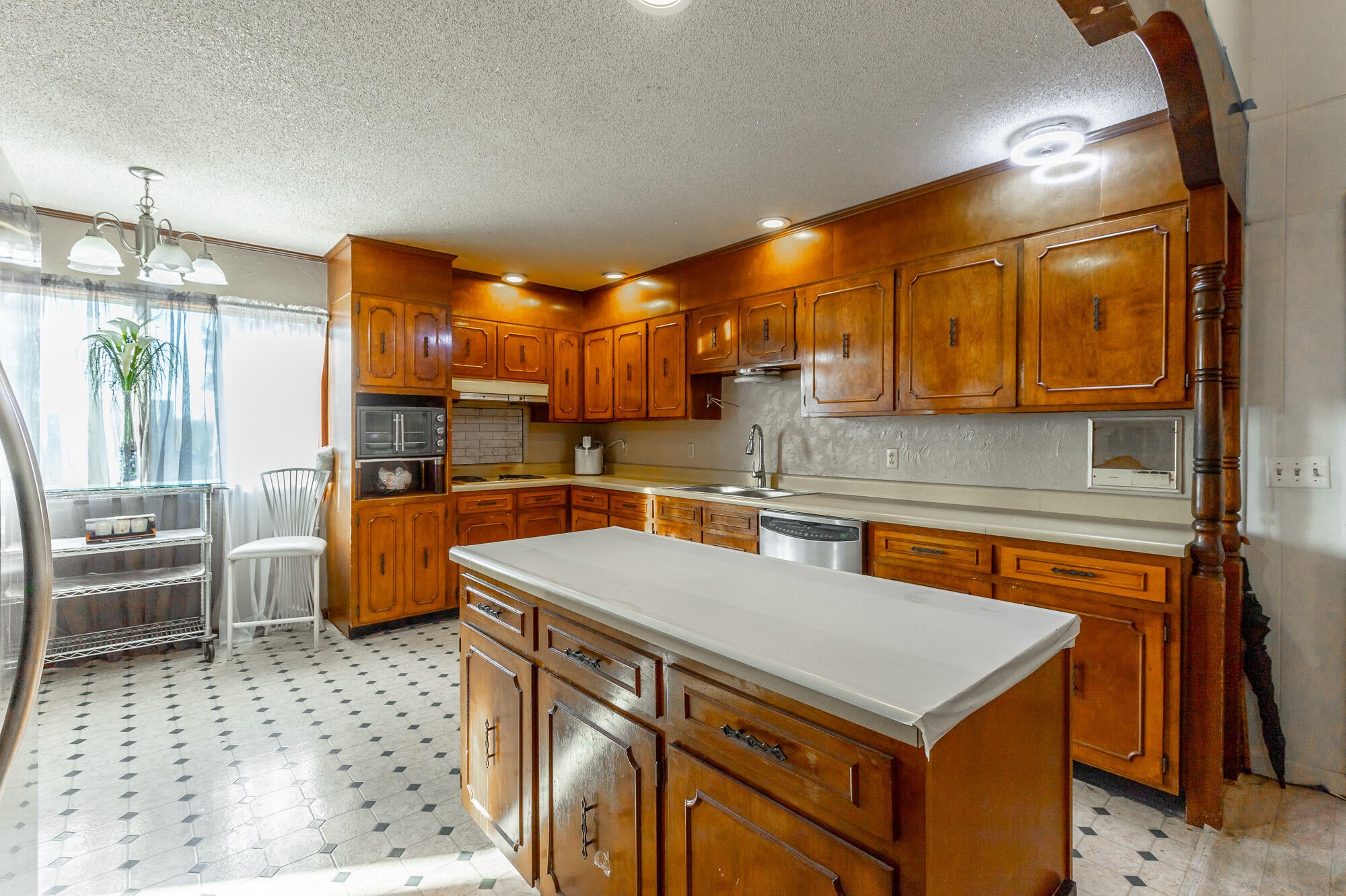 8417 Iris Drive Chattanooga, TN 37421 - Photo 22 of 90 a kitchen with a sink a stove and chairs