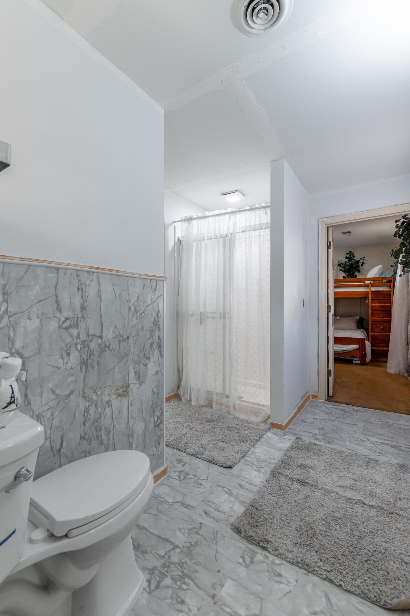 8417 Iris Drive Chattanooga, TN 37421 - Photo 43 of 90 a bathroom with a toilet and a shower