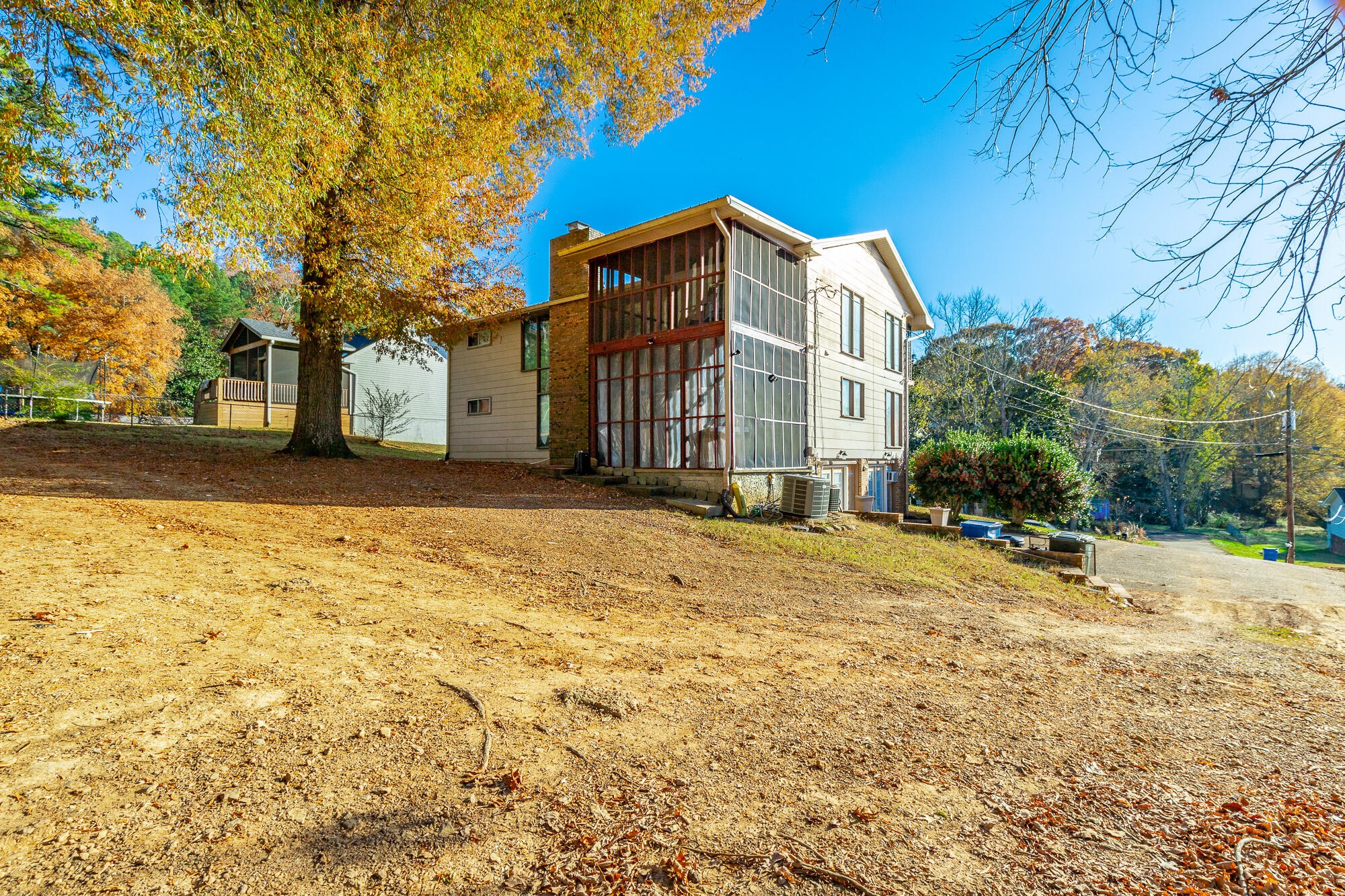 8417 Iris Drive Chattanooga, TN 37421 - Photo 77 of 90 a brick house with a large trees in front of it