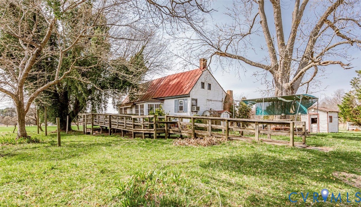 2326 Johnville Road Dunnsville, VA 22454 - Photo 2 of 13 View of grassy yard featuring an outdoor structure